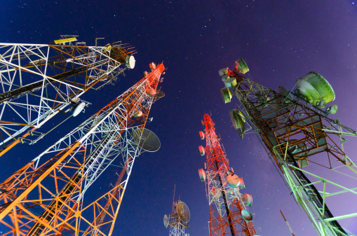 Telecommunication mast with microwave link and TV transmitter antennas in night sky . long exposure about 2-3 minutes