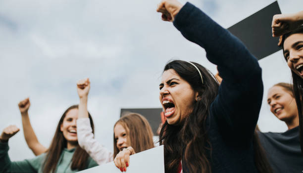 Group of angry female activists is protesting  protestor stock pictures, royalty-free photos & images