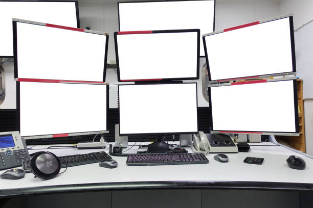 group of blank monitors and screen on security desk or control room for monitor process or stock data trading. stock photo