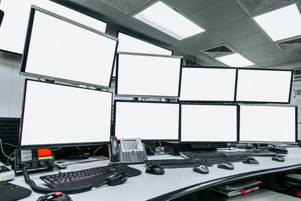 group of blank monitors and screen on security desk or control room for monitor process or stock data trading stock photo