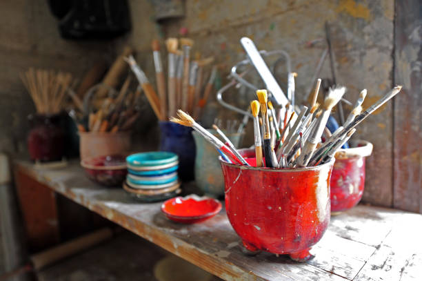 Group of brushes in art studio stock photo
