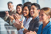 istock Group of business people applauding a presentation. 1330989185