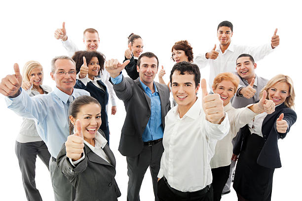 Group of business people holding up their thumbs Group of a happy Business People Showing Thumbs Up. business thumbs up stock pictures, royalty-free photos & images