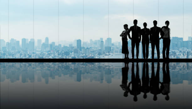 Group of businessperson in front of the city. Group of businessperson in front of the city. high society stock pictures, royalty-free photos & images