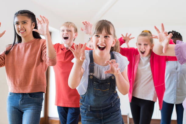 Group Of Children Enjoying Drama Class Together Group Of Children Enjoying Drama Class Together philippine girl stock pictures, royalty-free photos & images