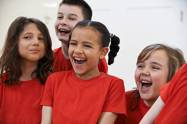 Group Of Children Enjoying Drama Class Together Group Of Children Enjoying Drama Class Together acting performance stock pictures, royalty-free photos & images