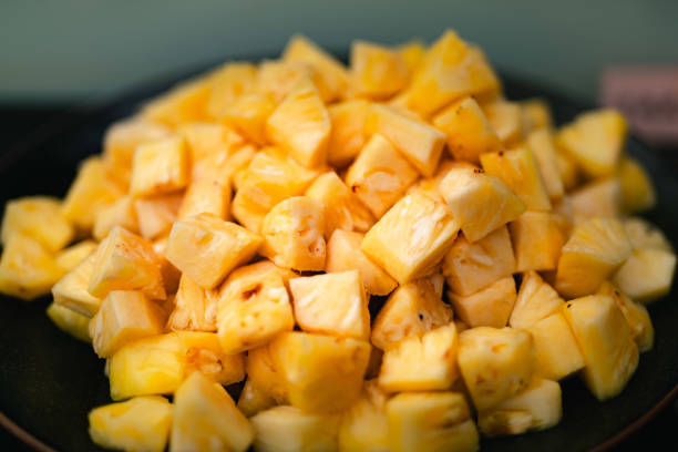 A group of chop pineapples on the plate stock photo