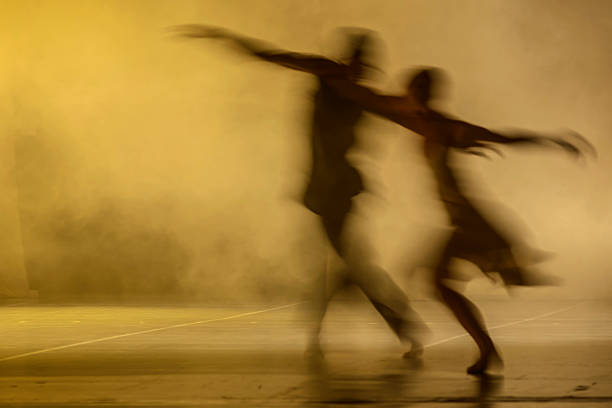 Group of contemporary dancers performing on stage stock photo