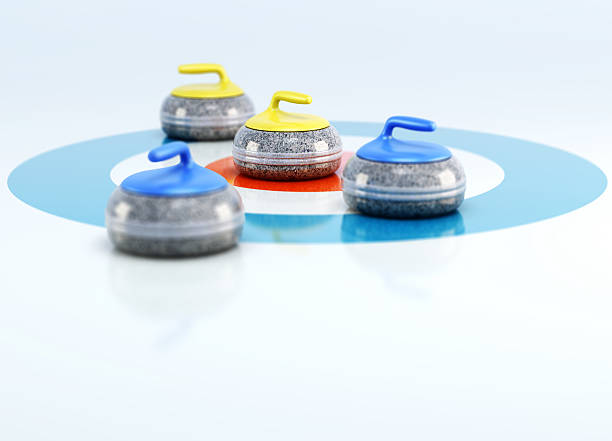 group of curling stones in the center - curling stockfoto's en -beelden