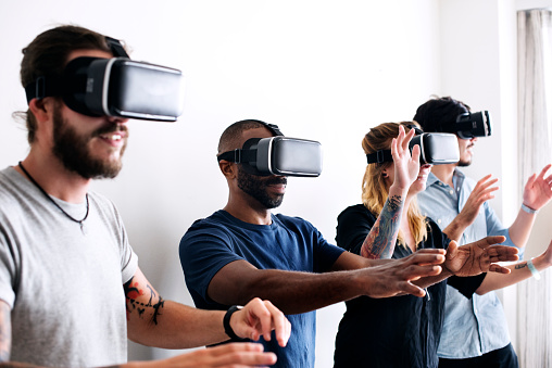Group Of Diverse Friends Experiencing Virtual Reality With