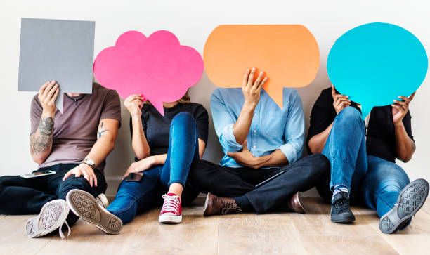 Group of diverse people with speech bubbles icons Group of diverse people with speech bubbles icons covering photos stock pictures, royalty-free photos & images