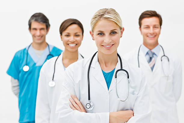 Group of doctors against white background stock photo