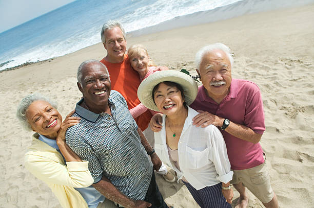 group of friends at beach - retirement overview bildbanksfoton och bilder