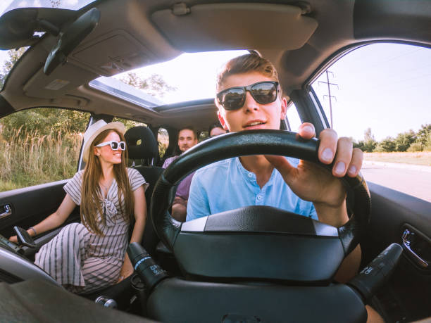 group of friends in car stock photo