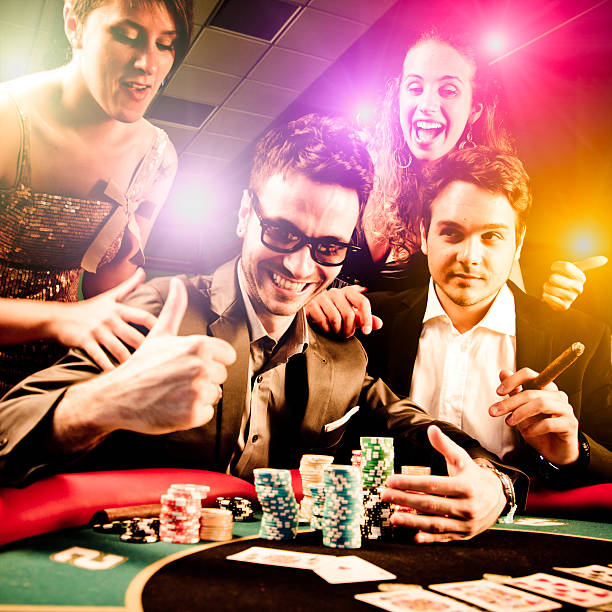 Group of friends winning at Casino Group of friends winning at Casino real money casino stock pictures, royalty-free photos & images