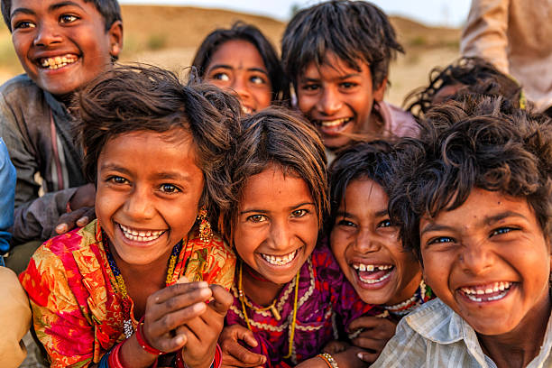 Group of happy Gypsy Indian children, desert village, India stock photo