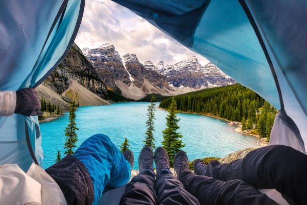 Group of mountaineer resting and enjoying view of Moraine Lake at national park stock photo