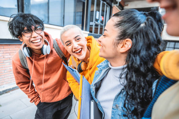 Group of multiracial students walking in college campus - Happy young people having fun at university - Teenagers hanging outside together - Back to school concept Group of multiracial students walking in college campus - Happy young people having fun at university - Teenagers hanging outside together - Back to school concept italy scholarships stock pictures, royalty-free photos & images