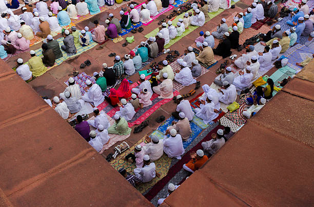 group of muslim men praying and performing namaaz - salah stok fotoğraflar ve resimler