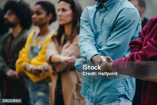 istock Group of people activists protesting on streets, women march and demonstration concept. 1282328162