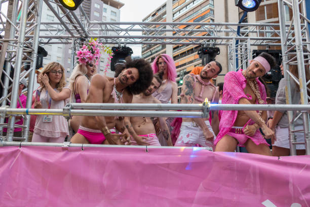 Valencia, Spain - June 16, 2018: A group of people dancing a choreography in a float during the gay pride day parade. stock photo