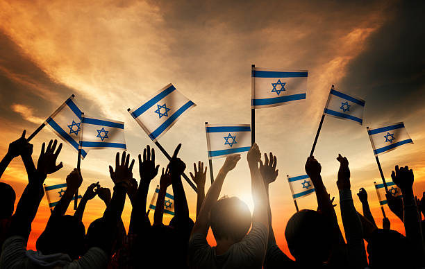 Group of People Waving the Flag of Israel stock photo