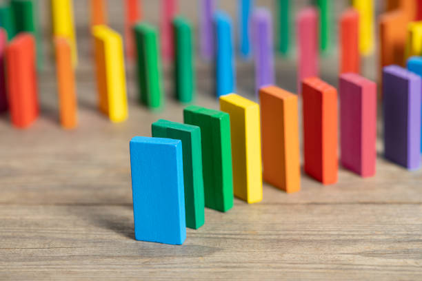 Group of rainbow colors wooden domino stock photo
