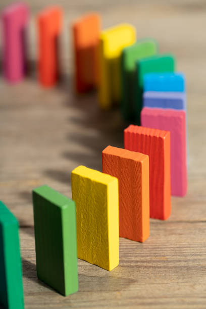 Group of rainbow colors wooden domino stock photo