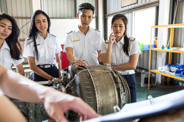 Group of Students at Aviation University during practical class Group of Students at Aviation University during practical class Aeronautical engineer stock pictures, royalty-free photos & images