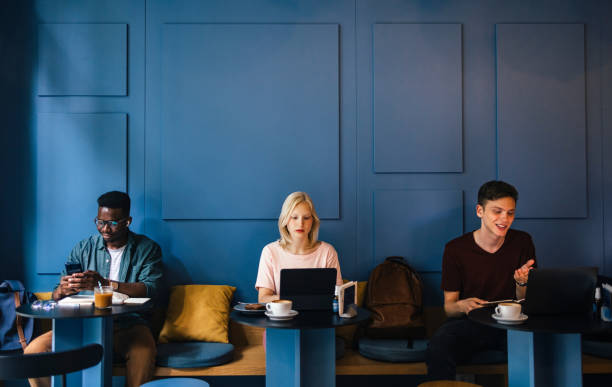 Group of Students Sitting in a Coffee Shop stock photo