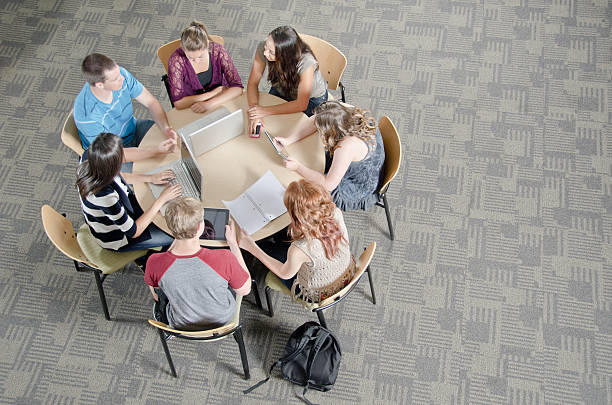 Group Of Tech Savy Students Studying Together stock photo