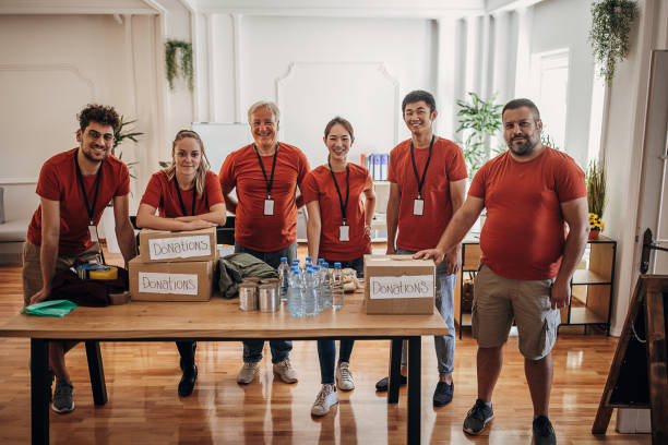 Group of volunteers at the donation center stock photo