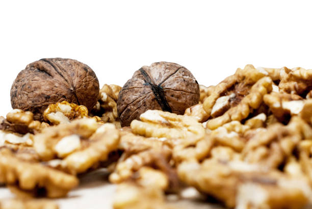 Group of walnuts spilled on the table stock photo