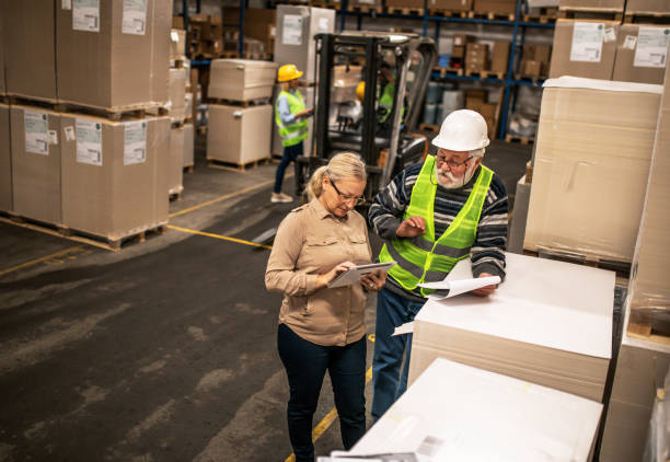Group of workers working in a warehouse stock photo