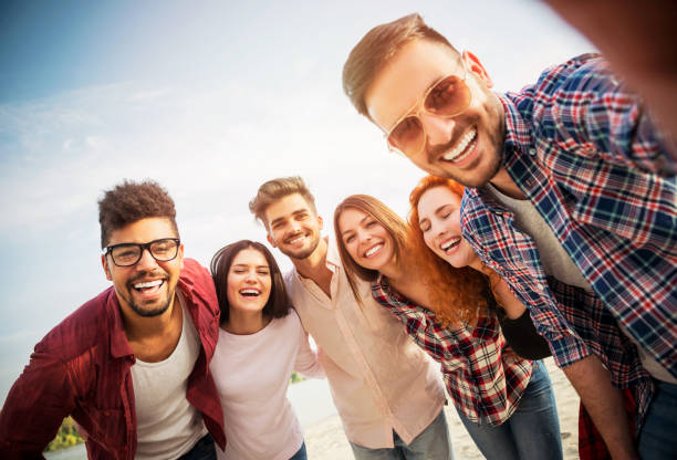 Group of young people having fun outdoors stock photo