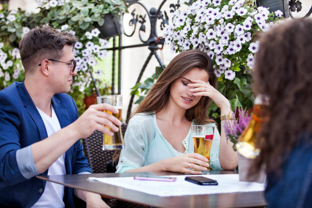 Group of young people sitting in a beer garden stock photo