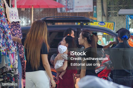 Group of young thai women and one mother with baby on arms
