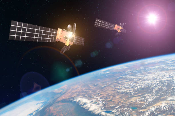 Group space satellite orbiting the earth and bright lights sun reflected from solar panels. Elements of this image furnished by NASA. Group space satellite orbiting the earth and bright lights sun reflected from solar panels. Elements of this image furnished by NASA satellites in space stock pictures, royalty-free photos & images
