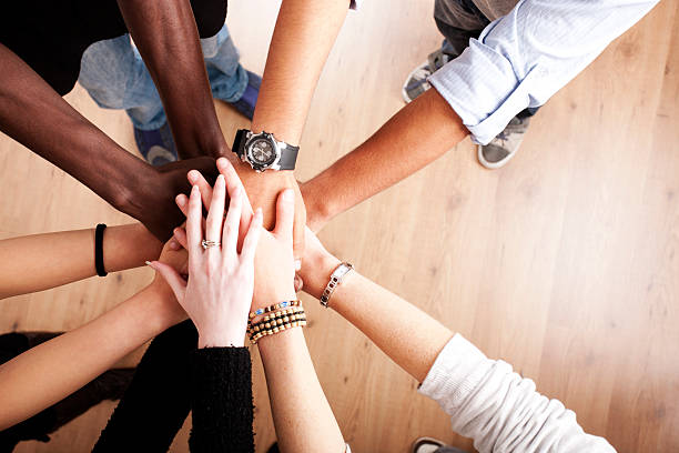 Group with hands together stock photo