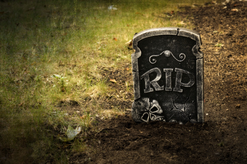 closeup Grunge grave with tombstone