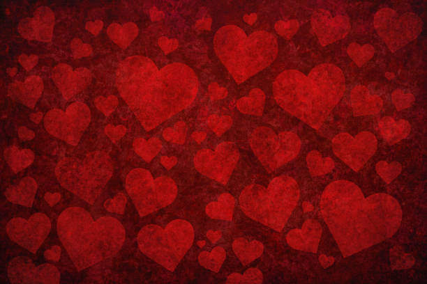 Grunge red background with heart shapes stock photo