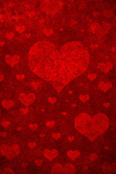 Grunge red background with heart shapes stock photo