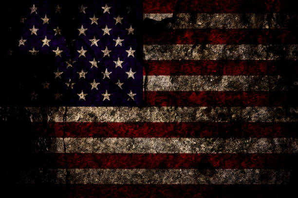 Grunge rocky US flag Patriotic military background - grunge and vintage flag of United States of America blended with natural dark grey stone or rock (mixed). distressed american flag stock pictures, royalty-free photos & images