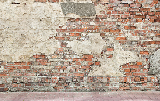 grunge wall background, bricks and pieces of plaster