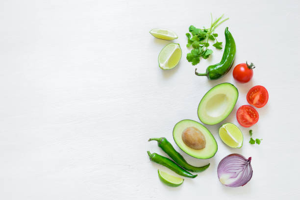 Guacamole ingredients background Guacamole cooking ingredients concept background with a space for a text, flat lay arrangement, overhead view pepper vegetable stock pictures, royalty-free photos & images