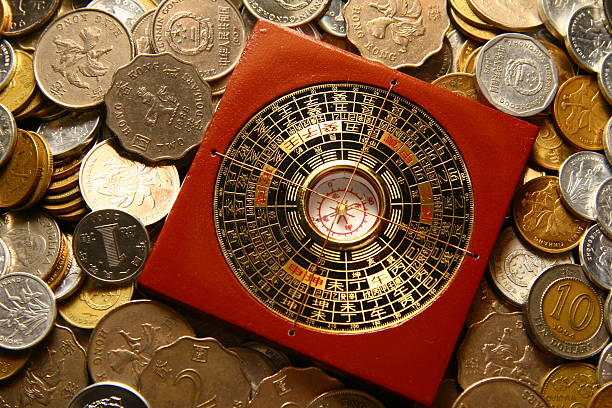 guide to fortune in China luopan compass among coins - wider angle feng shui stock pictures, royalty-free photos & images