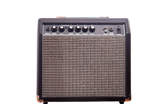 Guitar and electric bass amplifier on white background.