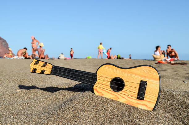 Guitar on the Sand Beach stock photo