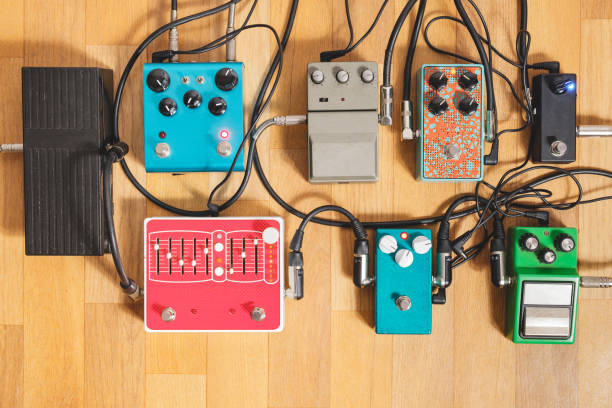 Guitar pedalboard on the floor of a recording studio. stock photo