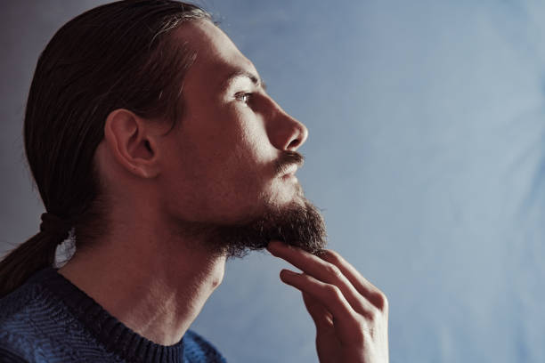 guy with a long beard in profile stock photo